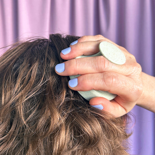 Why using a scalp massager might be the best thing you do for your hair